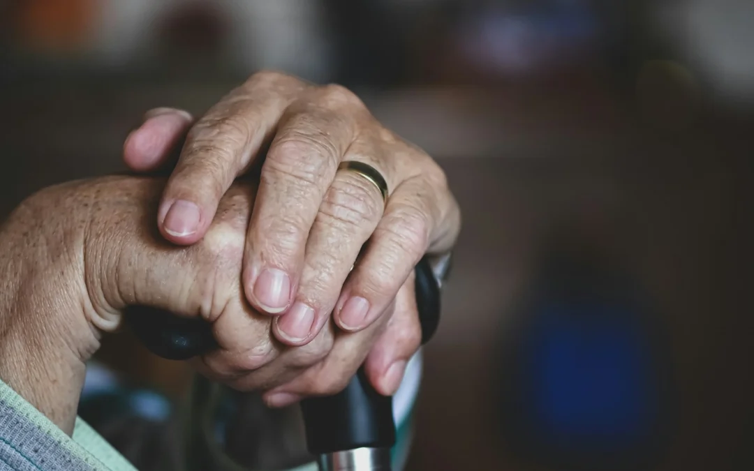 99-year-old woman wearing an mCareWatch MW241 watch for seniors to support independent living and family peace of mind.